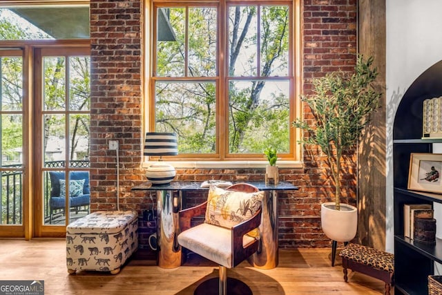 living area with a wealth of natural light and wood finished floors