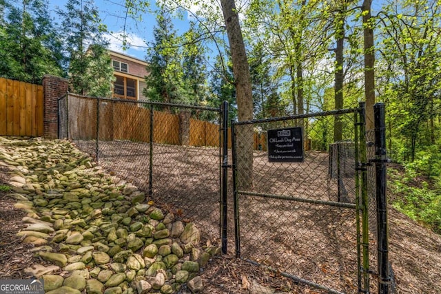 view of gate featuring fence