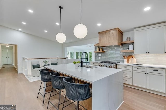 808 Sherwood Rd, Gainesville, GA 30501 - kitchen featuring open shelves, decorative backsplash, a kitchen bar, light countertops, and vaulted ceiling
