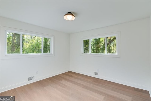 808 Sherwood Rd, Gainesville, GA 30501 - empty room with plenty of natural light and wood finished floors