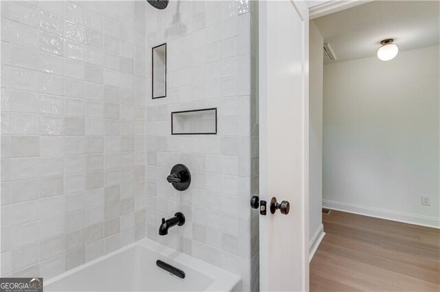 808 Sherwood Rd, Gainesville, GA 30501 - full bath featuring wood finished floors and shower / bath combination