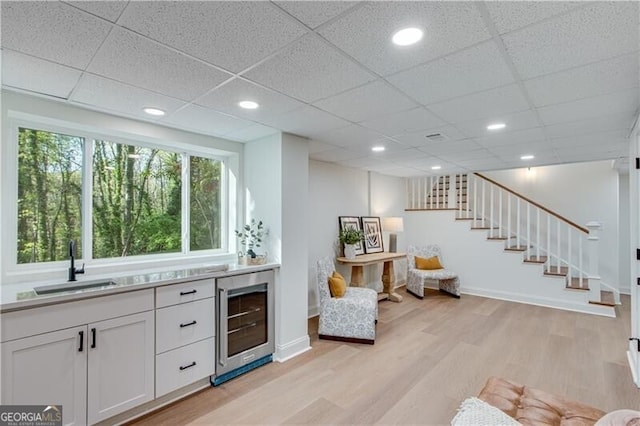 808 Sherwood Rd, Gainesville, GA 30501 - bar area featuring wine cooler, light wood finished floors, stairway, a drop ceiling, and recessed lighting