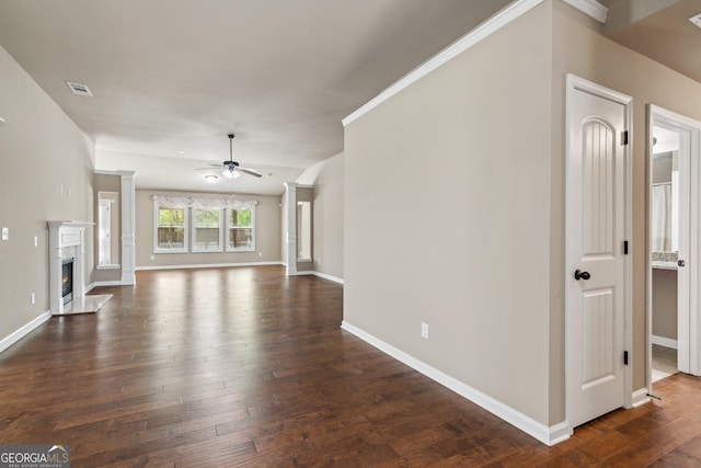 4580 Orchard Ridge Ct, Cumming, GA 30028 - unfurnished living room featuring a high end fireplace, ceiling fan, visible vents, baseboards, and dark wood-style floors