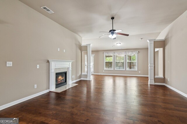 4580 Orchard Ridge Ct, Cumming, GA 30028 - unfurnished living room featuring decorative columns, ceiling fan, visible vents, a high end fireplace, and dark wood-style floors