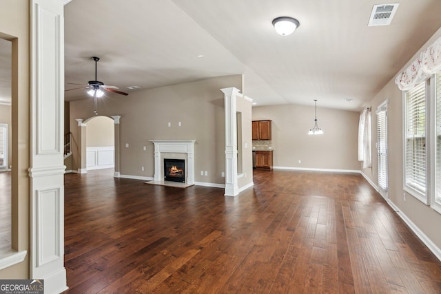 4580 Orchard Ridge Ct, Cumming, GA 30028 - unfurnished living room featuring dark wood-type flooring, ceiling fan, a glass covered fireplace, and vaulted ceiling