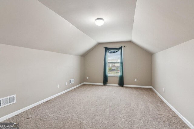 4580 Orchard Ridge Ct, Cumming, GA 30028 - additional living space with visible vents, vaulted ceiling, and carpet floors
