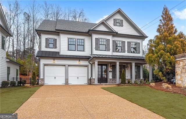 view of front of house with a standing seam roof, a garage, covered porch, brick siding, and concrete driveway