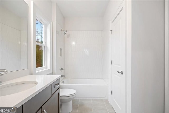 full bath with tile patterned floors, bathing tub / shower combination, vanity, and toilet