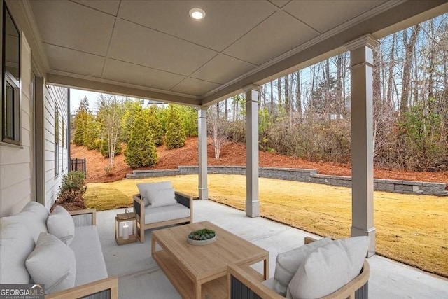 sunroom with an outdoor living space and a wealth of natural light