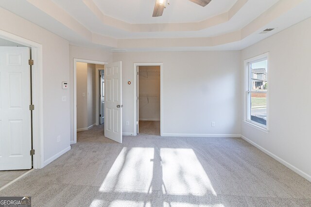 288 Pine Way, Dallas, GA 30157 - unfurnished bedroom featuring a raised ceiling, a spacious closet, carpet, and visible vents