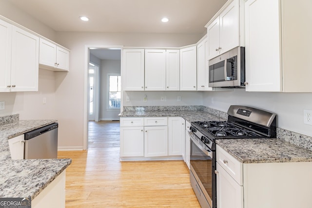 288 Pine Way, Dallas, GA 30157 - kitchen featuring white cabinetry, recessed lighting, light wood finished floors, stainless steel appliances, and light stone counters