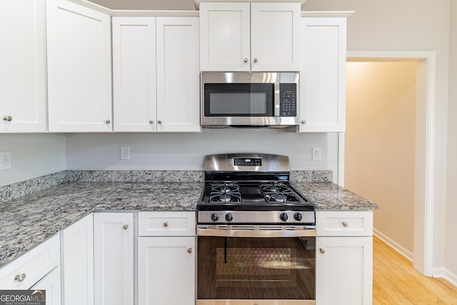 288 Pine Way, Dallas, GA 30157 - kitchen featuring stainless steel appliances and white cabinets