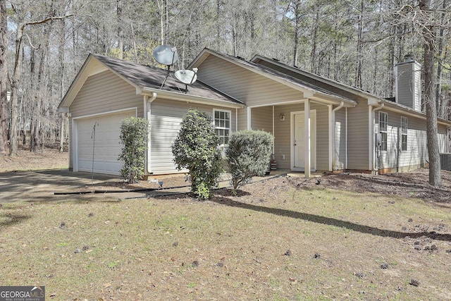 1109 Allen Rd, Grantville, GA 30220 - single story home with concrete driveway, a chimney, and an attached garage
