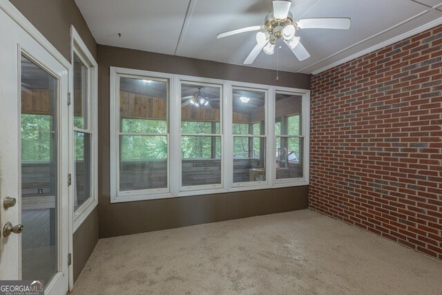 516 Turner Rd, Concord, GA 30206 - unfurnished sunroom with brick wall and carpet flooring