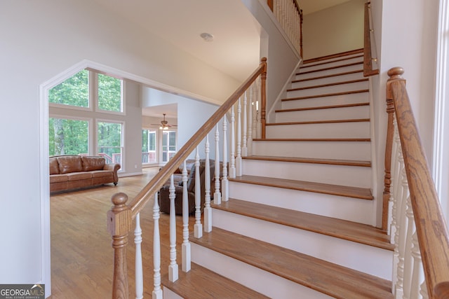 516 Turner Rd, Concord, GA 30206 - stairway featuring wood finished floors, a ceiling fan, and vaulted ceiling