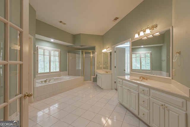 516 Turner Rd, Concord, GA 30206 - bathroom featuring tile patterned floors, a shower stall, a garden tub, and two vanities