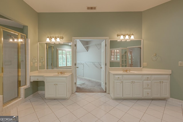 516 Turner Rd, Concord, GA 30206 - bathroom with plenty of natural light, a stall shower, tile patterned floors, and two vanities