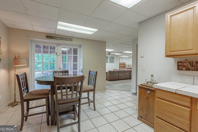 516 Turner Rd, Concord, GA 30206 - dining area with a paneled ceiling, french doors, light tile patterned flooring, and baseboards
