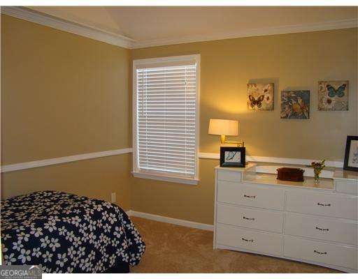 113 Sunrise Ln, Savannah, GA 31419 - carpeted bedroom featuring ornamental molding and baseboards