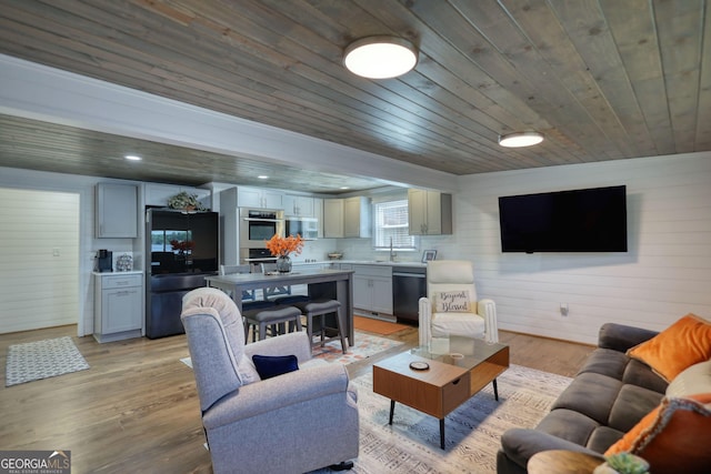 480 Friar Tuck Cir, Covington, GA 30014 - living area with wood walls, light wood-type flooring, and wooden ceiling