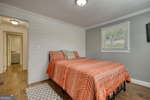 480 Friar Tuck Cir, Covington, GA 30014 - bedroom with wood walls, wood-type flooring, ornamental molding, and baseboards