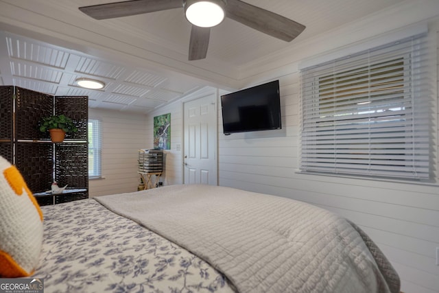 480 Friar Tuck Cir, Covington, GA 30014 - bedroom with wooden walls and ceiling fan