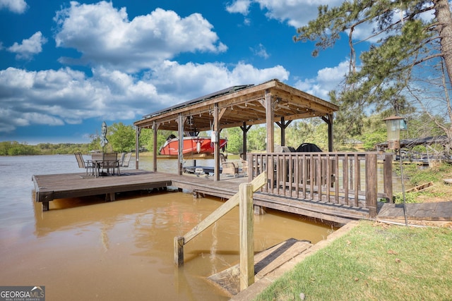 480 Friar Tuck Cir, Covington, GA 30014 - view of dock featuring boat lift and a water view