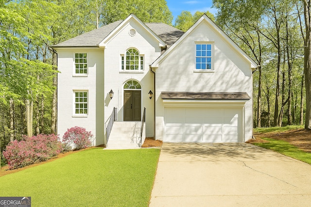 8660 Anchor On Lanier Ct, Gainesville, GA 30506 - traditional home with a garage, driveway, a standing seam roof, a front yard, and a shingled roof