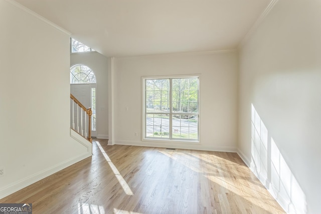 8660 Anchor On Lanier Ct, Gainesville, GA 30506 - entrance foyer featuring light wood-style floors, baseboards, stairway, and ornamental molding