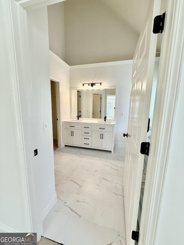 8660 Anchor On Lanier Ct, Gainesville, GA 30506 - bathroom featuring double vanity, baseboards, marble look tiles, and high vaulted ceiling