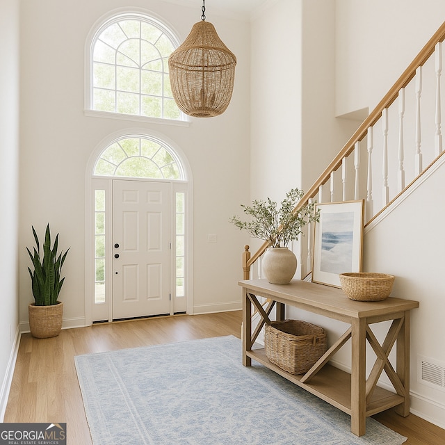 8660 Anchor On Lanier Ct, Gainesville, GA 30506 - entryway with wood finished floors, a high ceiling, stairs, and baseboards