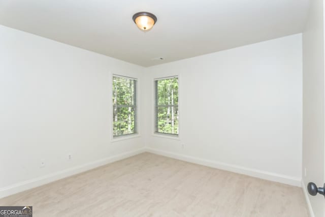 8660 Anchor On Lanier Ct, Gainesville, GA 30506 - unfurnished room with baseboards and light colored carpet