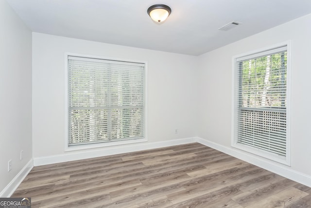 8660 Anchor On Lanier Ct, Gainesville, GA 30506 - unfurnished room featuring wood finished floors and baseboards