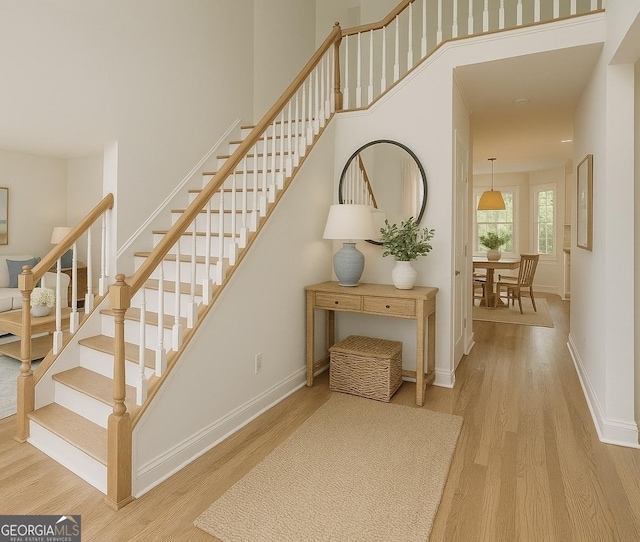 8660 Anchor On Lanier Ct, Gainesville, GA 30506 - staircase with wood finished floors and baseboards