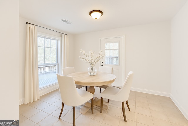 8660 Anchor On Lanier Ct, Gainesville, GA 30506 - dining area featuring healthy amount of natural light, light tile patterned floors, and baseboards