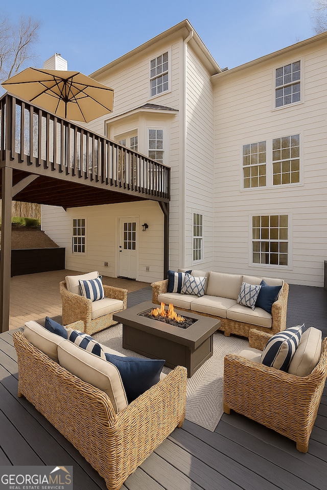 8660 Anchor On Lanier Ct, Gainesville, GA 30506 - deck featuring an outdoor living space with a fire pit