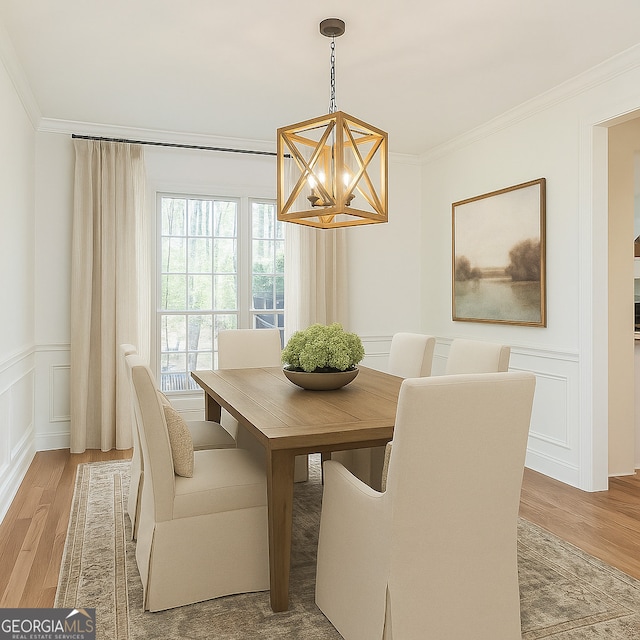 8660 Anchor On Lanier Ct, Gainesville, GA 30506 - dining space featuring a chandelier, a decorative wall, light wood-style flooring, ornamental molding, and a wainscoted wall