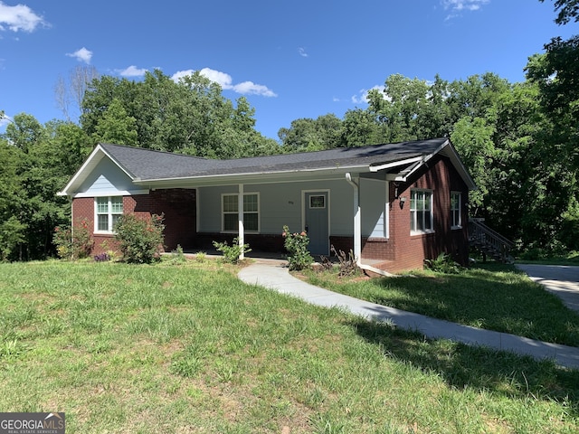 2467 Shady Grove Rd, Carrollton, GA 30116 - single story home featuring brick siding and a front lawn
