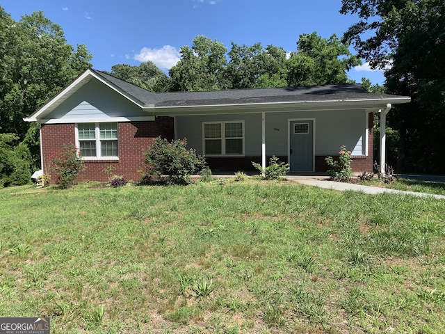 2467 Shady Grove Rd, Carrollton, GA 30116 - ranch-style home with brick siding and a front yard