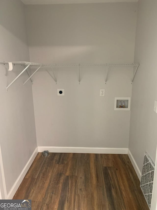 2467 Shady Grove Rd, Carrollton, GA 30116 - laundry room with washer hookup, baseboards, wood finished floors, and hookup for an electric dryer