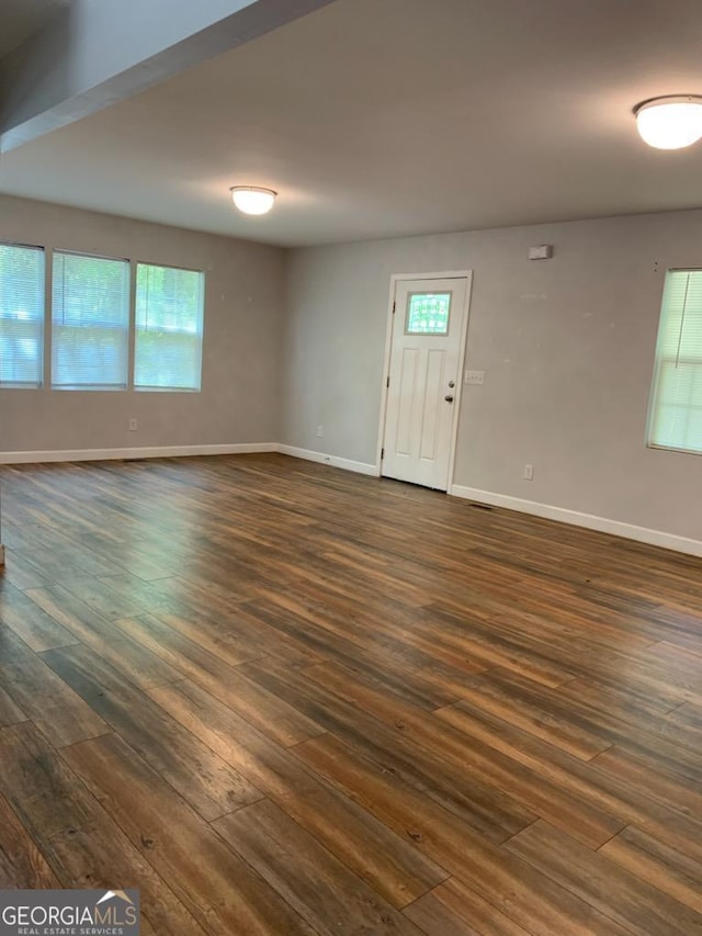 2467 Shady Grove Rd, Carrollton, GA 30116 - unfurnished room featuring dark wood-style flooring and baseboards
