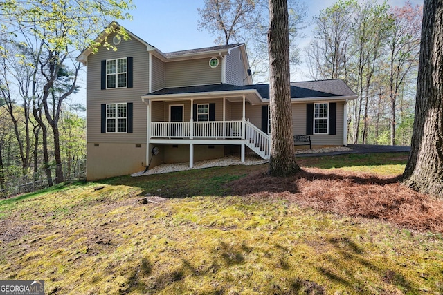 traditional-style home featuring a front yard, a porch, and crawl space
