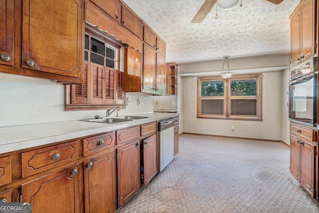 kitchen with oven, stainless steel dishwasher, a sink, light colored carpet, and ceiling fan