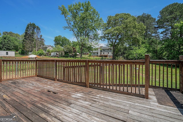 wooden terrace featuring a residential view