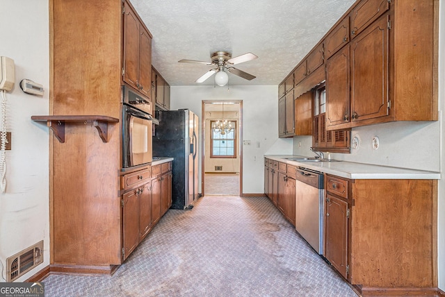 kitchen with dishwasher, visible vents, black oven, ceiling fan, and refrigerator with ice dispenser