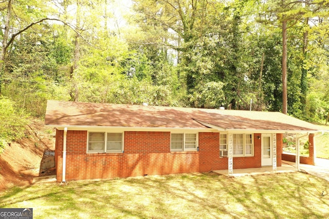 view of outdoor structure featuring an attached carport