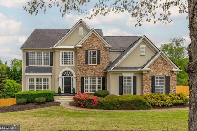 2635 Stonehill Dr, Cumming, GA 30041 - view of front of property featuring a front lawn, stone siding, a standing seam roof, and stucco siding