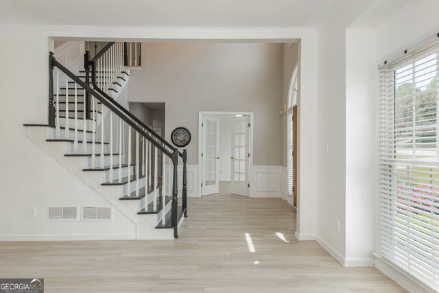 2635 Stonehill Dr, Cumming, GA 30041 - foyer featuring stairway, french doors, visible vents, and wood finished floors