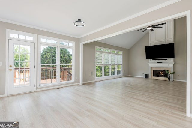 2635 Stonehill Dr, Cumming, GA 30041 - unfurnished living room with a lit fireplace, light wood finished floors, baseboards, and a ceiling fan