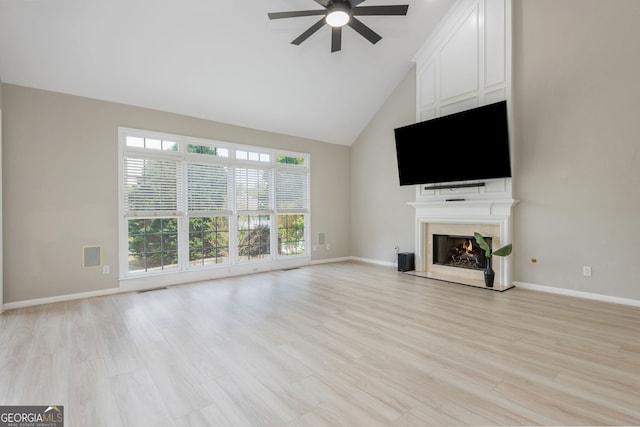 2635 Stonehill Dr, Cumming, GA 30041 - unfurnished living room with high vaulted ceiling, a large fireplace, baseboards, and a ceiling fan